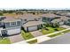 Two-story home with brick driveway and well-manicured front yard at 3294 Hanging Tide St, Winter Garden, FL 34787