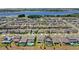 Extensive aerial view of the community, highlighting homes, green spaces, and a scenic lake at 3294 Hanging Tide St, Winter Garden, FL 34787