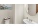Powder room featuring a modern sink, a nearby toilet, and subtle decor at 3294 Hanging Tide St, Winter Garden, FL 34787