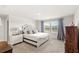 Bedroom with neutral carpet, a queen bed and natural light at 3294 Hanging Tide St, Winter Garden, FL 34787