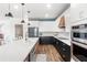 Spacious kitchen with custom cabinets, stainless appliances, quartz countertops, and an island at 3294 Hanging Tide St, Winter Garden, FL 34787