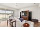 Comfortable living room with hardwood floors, a ceiling fan, and a view of the backyard at 3294 Hanging Tide St, Winter Garden, FL 34787