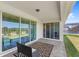 Covered patio with neutral flooring and furnishings, providing seamless indoor/outdoor living at 3294 Hanging Tide St, Winter Garden, FL 34787