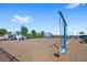 Community playground with swings and play structures on a sunny day at 3294 Hanging Tide St, Winter Garden, FL 34787