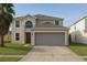 Charming two-story home with well-maintained lawn and a spacious two-car garage at 358 Fairfield Dr, Sanford, FL 32771