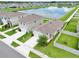 This aerial view shows a well-maintained home and landscaped backyard with a pond view at 3945 Angola Ln, Sanford, FL 32771