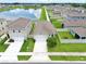 Aerial view of a home and neighborhood near a pond at 3945 Angola Ln, Sanford, FL 32771