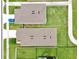 Aerial view showing two houses with fenced yards, green lawns, and driveways, with a car parked in one at 3945 Angola Ln, Sanford, FL 32771