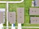 Aerial view of suburban houses with green lawns and driveways creating a neat, orderly neighborhood at 3945 Angola Ln, Sanford, FL 32771