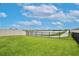 The backyard has lush green grass and faces a tranquil lake and pond at 3945 Angola Ln, Sanford, FL 32771