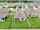 Aerial view showing the backyard and fence surrounding the property, with a patio and some furniture at 3945 Angola Ln, Sanford, FL 32771