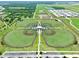 Wide aerial view highlighting multiple baseball fields with well-maintained greens, connecting pathways, and ample parking at 3945 Angola Ln, Sanford, FL 32771