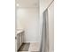 Bright bathroom featuring modern fixtures, shower with curtain, and tile flooring at 3945 Angola Ln, Sanford, FL 32771