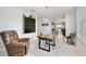 Stylish dining area featuring a modern table, unique light fixture, and contemporary decor at 3945 Angola Ln, Sanford, FL 32771
