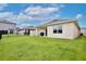 Well-maintained backyard featuring lush green grass, great for outdoor activities at 3945 Angola Ln, Sanford, FL 32771