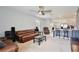Open-concept living room with comfortable seating and seamless flow into the kitchen at 3945 Angola Ln, Sanford, FL 32771