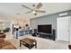 Inviting living space featuring an open floor plan, kitchen bar, and ample seating at 3945 Angola Ln, Sanford, FL 32771