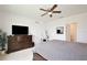 Comfortable main bedroom featuring neutral colors, a large dresser, and a well-lit vanity at 3945 Angola Ln, Sanford, FL 32771