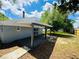 Spacious backyard with a covered deck, perfect for outdoor entertaining at 412 Editha Cir, Sanford, FL 32771