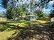 Spacious backyard featuring mature trees, providing ample shade and privacy at 412 Editha Cir, Sanford, FL 32771