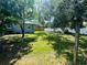 Expansive backyard with mature trees and well-maintained lawn, great for recreation at 412 Editha Cir, Sanford, FL 32771
