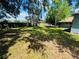 The backyard has mature trees offering plenty of shade and a wood fence at 412 Editha Cir, Sanford, FL 32771