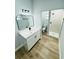 Updated bathroom features a modern vanity, an updated shower, and vinyl flooring at 412 Editha Cir, Sanford, FL 32771
