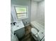 Updated bathroom with tub, modern vanity, and white marble tile at 412 Editha Cir, Sanford, FL 32771