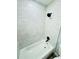 Updated bathroom with white tiled walls and modern black fixtures at 412 Editha Cir, Sanford, FL 32771