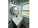 Renovated bathroom featuring a modern vanity and updated lighting at 412 Editha Cir, Sanford, FL 32771