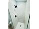 Updated bathroom with white marble-look tile shower and black hardware at 412 Editha Cir, Sanford, FL 32771