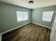 Well-lit room with hardwood floors and neutral paint at 412 Editha Cir, Sanford, FL 32771