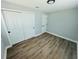 Bedroom featuring wood-look flooring and closet space at 412 Editha Cir, Sanford, FL 32771