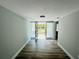 Entryway with wood-look floors and frosted glass sidelights next to front door at 412 Editha Cir, Sanford, FL 32771