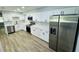 Updated kitchen featuring white cabinetry, marble backsplash, and stainless appliances at 412 Editha Cir, Sanford, FL 32771