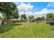 Large backyard featuring a shed, a hammock, and an outdoor seating area at 417 Carvell Dr, Winter Park, FL 32792