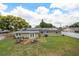 Spacious backyard with solar panels and an outdoor seating area at 417 Carvell Dr, Winter Park, FL 32792