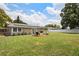 Spacious backyard with solar panels and an outdoor seating area at 417 Carvell Dr, Winter Park, FL 32792
