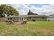 Spacious backyard with solar panels and an outdoor seating area at 417 Carvell Dr, Winter Park, FL 32792