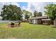 Lush backyard featuring a shed and an outdoor seating area at 417 Carvell Dr, Winter Park, FL 32792