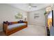 Light and bright bedroom with daybed, large windows, neutral walls and ceiling fan at 417 Carvell Dr, Winter Park, FL 32792