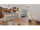 Open concept dining room and kitchen with breakfast bar and updated cabinets and decor at 417 Carvell Dr, Winter Park, FL 32792
