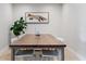 Elegant dining room with a modern table and stylish chairs under a fox-themed wall decor at 417 Carvell Dr, Winter Park, FL 32792