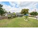 Inviting exterior with well-maintained lawn, lush landscaping, and solar panels for energy efficiency at 417 Carvell Dr, Winter Park, FL 32792