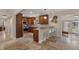 Lovely kitchen featuring wood cabinets, stainless appliances, and breakfast bar with seating at 417 Carvell Dr, Winter Park, FL 32792