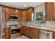 This kitchen features stainless steel appliances, granite countertops, and ample storage at 417 Carvell Dr, Winter Park, FL 32792
