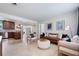 Bright living room with travertine floors, modern furniture, and an open concept at 417 Carvell Dr, Winter Park, FL 32792