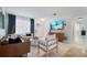 Bright living room with comfortable seating, modern decor, and ample natural light, creating a welcoming atmosphere at 417 Carvell Dr, Winter Park, FL 32792