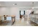 Bright open-concept living spaces with a dining table and a bar with kitchen access at 417 Carvell Dr, Winter Park, FL 32792