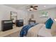 Cozy main bedroom with ceiling fan, neutral decor, large mirror and carpet at 417 Carvell Dr, Winter Park, FL 32792